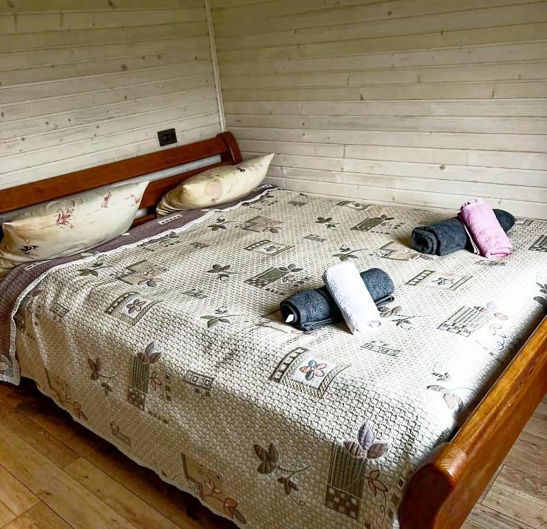 Postel nebo postele na pokoji v ubytování Садиба У Василини та Романа