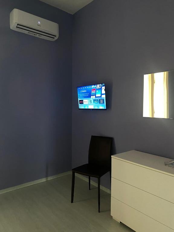 TV a/nebo společenská místnost v ubytování Marico Affittacamere Via Talarico civico 3