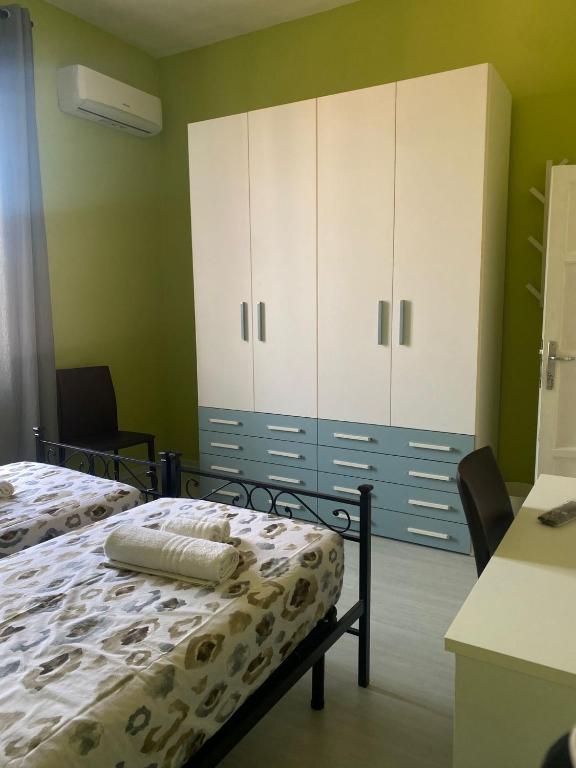 Postel nebo postele na pokoji v ubytování Marico Affittacamere Via Talarico civico 3