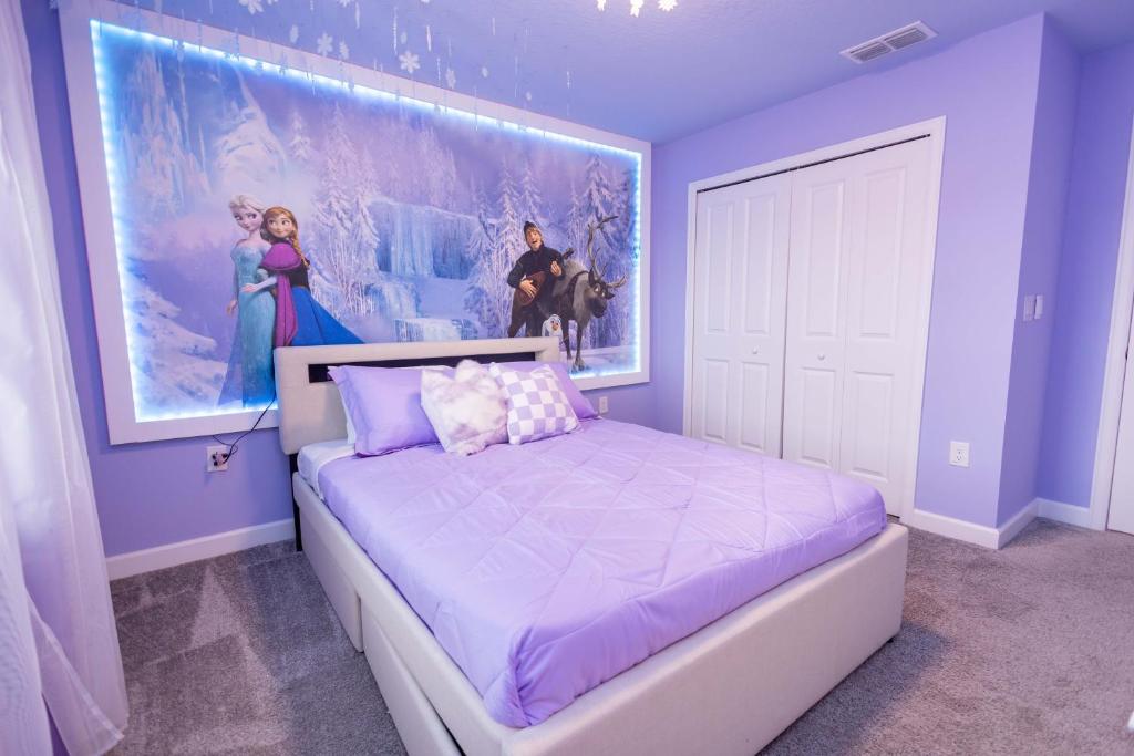 a bedroom with a king sized bed and a large painting at 2901 SS Discover Opulence 4-Bedroom Villa with Pool, and Magical Themed Rooms! in Kissimmee