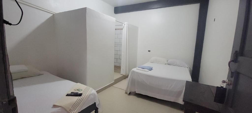 Postel nebo postele na pokoji v ubytování Hotel Adelmo's