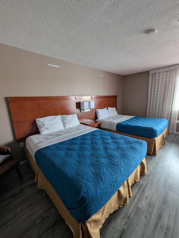 Postel nebo postele na pokoji v ubytování 7 Nights Stay