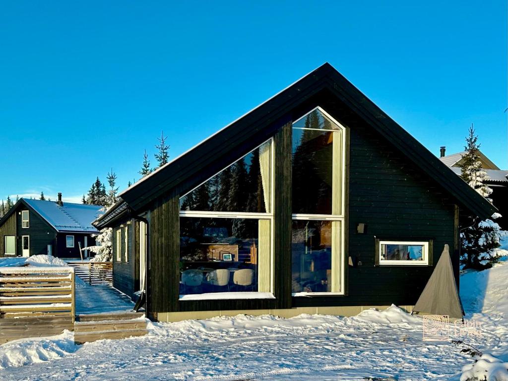 Cozy cabin on Sjusjølia by the trail network sauna v zimě