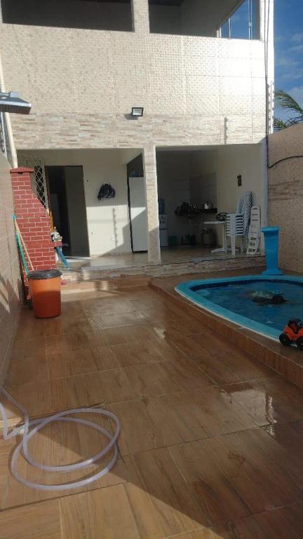 a house with a swimming pool and a patio at Casa Carapibus in Conde