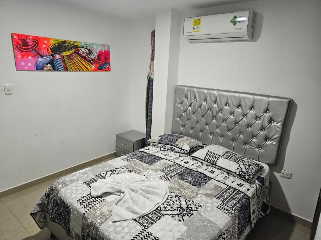Postel nebo postele na pokoji v ubytování Apartaestudios Galanni