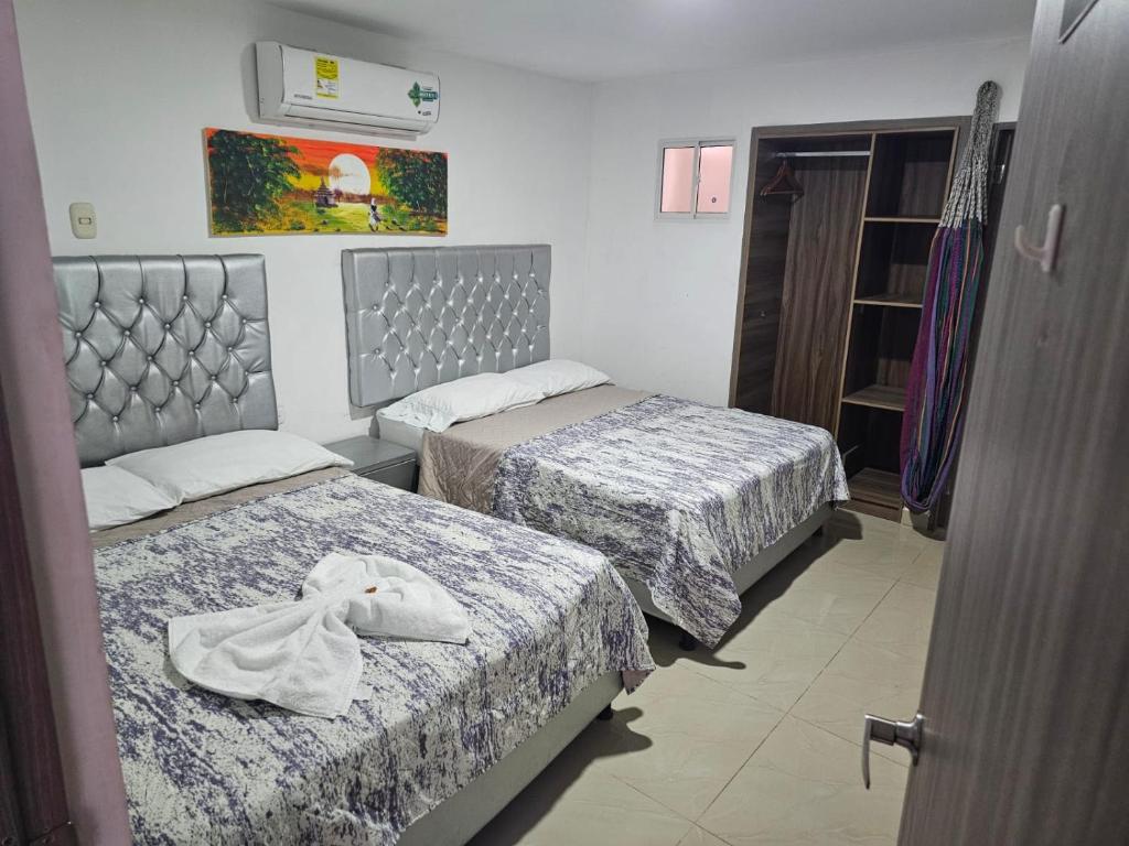 Postel nebo postele na pokoji v ubytování Apartaestudios Galanni