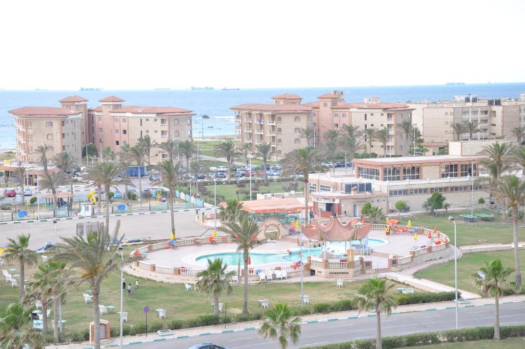 an aerial view of a resort with a swimming pool at Ajami Hotel Armed Forces Apartments in Alexandria