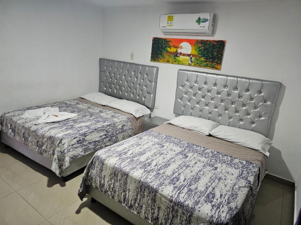 Postel nebo postele na pokoji v ubytování Apartaestudios Galanni