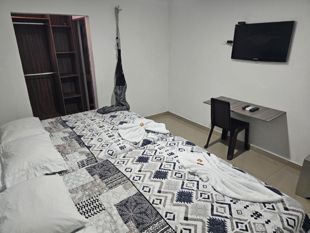Postel nebo postele na pokoji v ubytování Apartaestudios Galanni