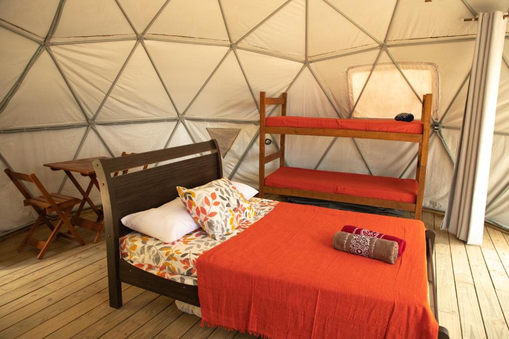 Voodi või voodid majutusasutuse Glamping Sitio das Tartarugas toas