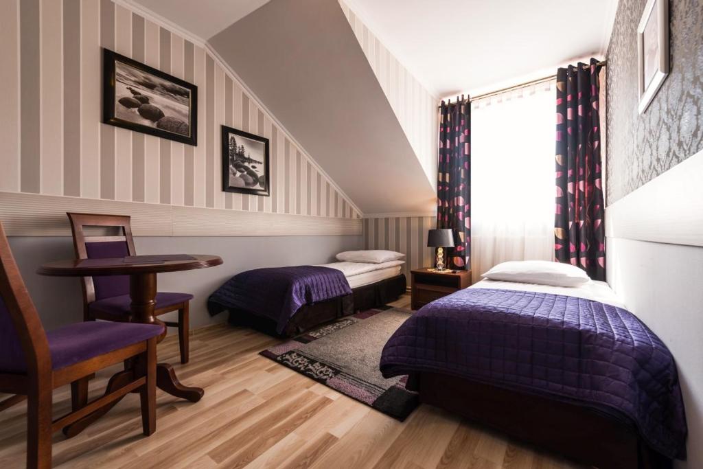Llit o llits en una habitació de Noclegi Komfort