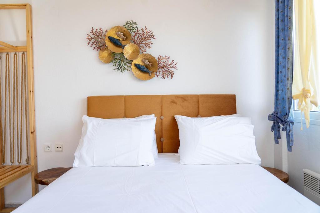 Postel nebo postele na pokoji v ubytování Cookoo Villas