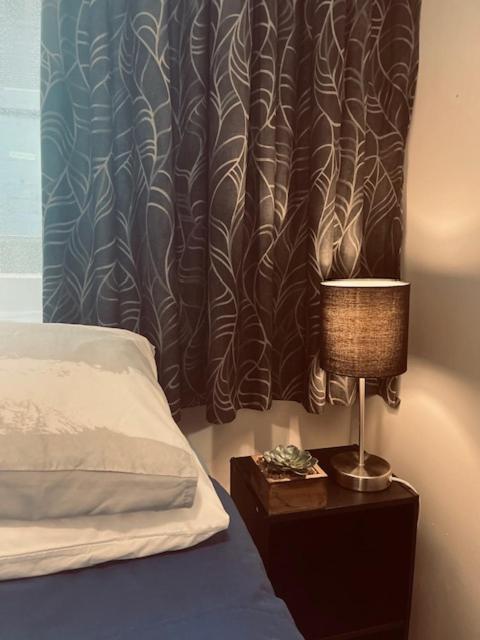 Voodi või voodid majutusasutuse CitiRooms Auckland toas