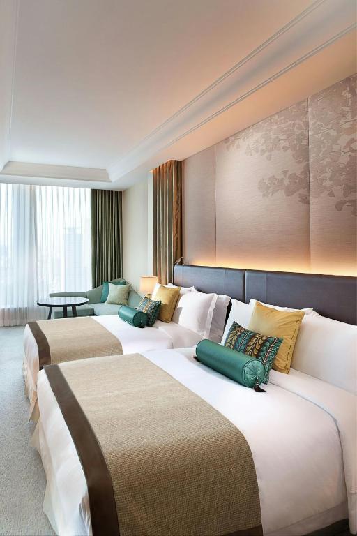 Postel nebo postele na pokoji v ubytování The St. Regis Osaka