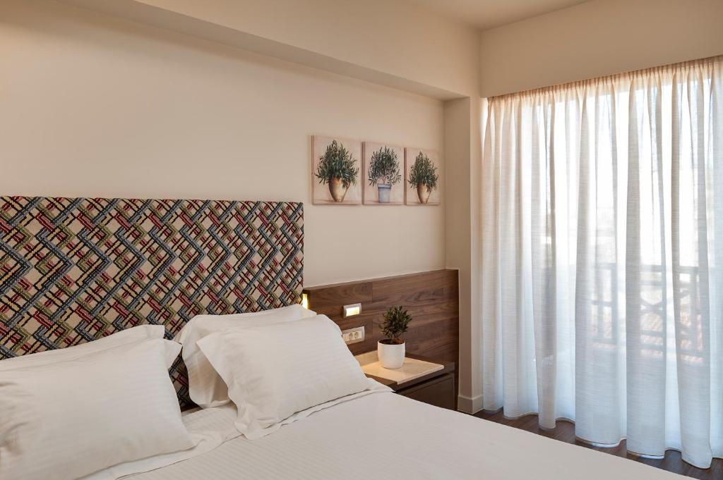 Postel nebo postele na pokoji v ubytování Civitel Akali Hotel