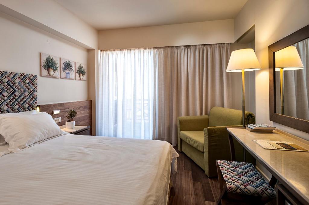 Postel nebo postele na pokoji v ubytování Civitel Akali Hotel