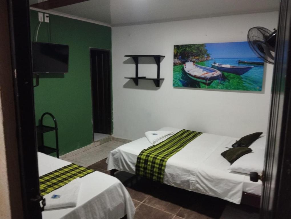 Postel nebo postele na pokoji v ubytování Hotel Sol y Mar