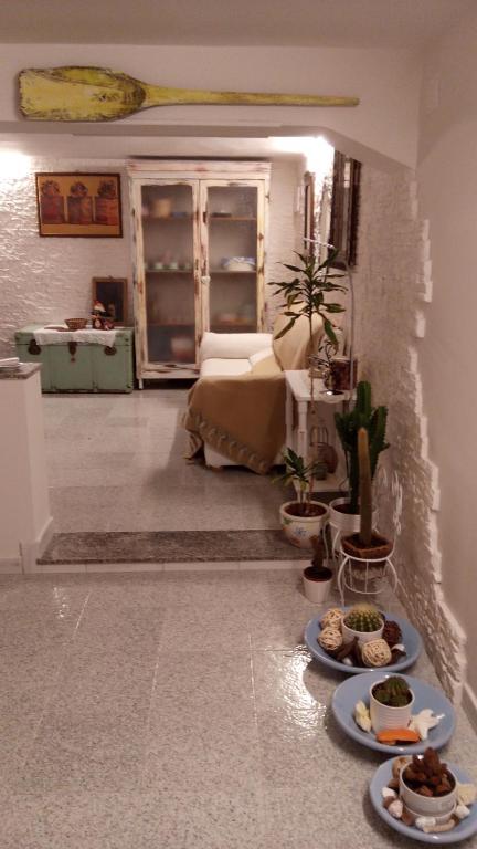 a living room with plates of food on the floor at La Tana del Nano in Ancona