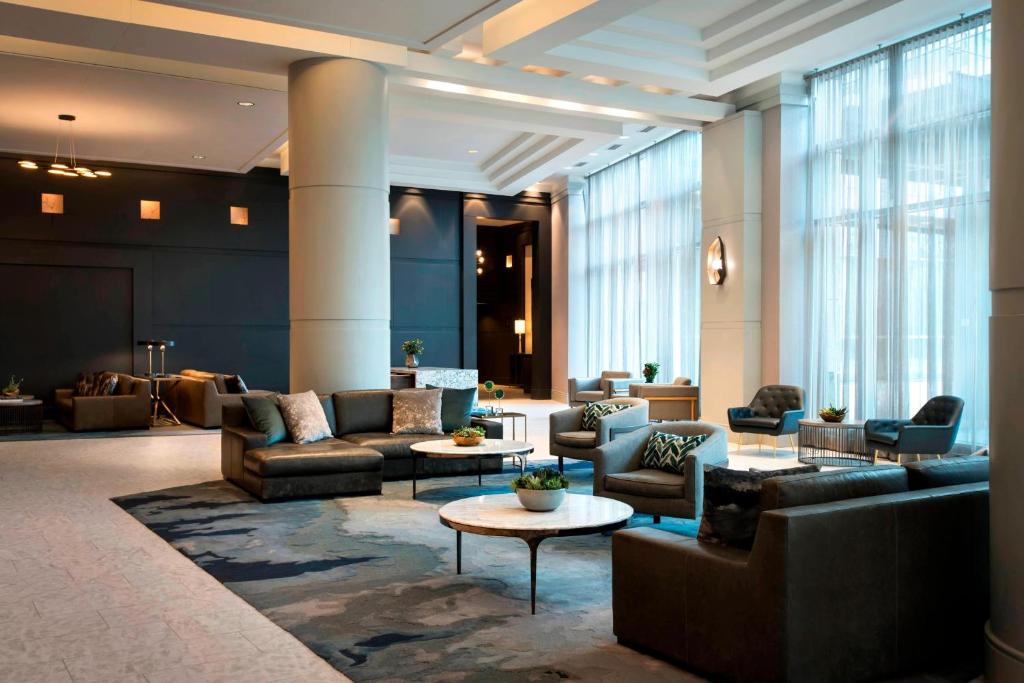 a lobby with couches and tables in a building at Bethesda North Marriott Hotel & Conference Center in Bethesda