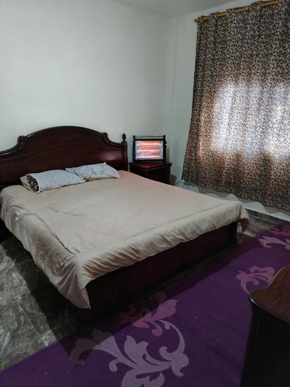 Postel nebo postele na pokoji v ubytování الشقة العائلية الحديثة familial new flat