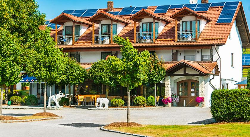 a house with solar panels on top of it at Landhotel Mappacher Hof in Bruck in der Oberpfalz