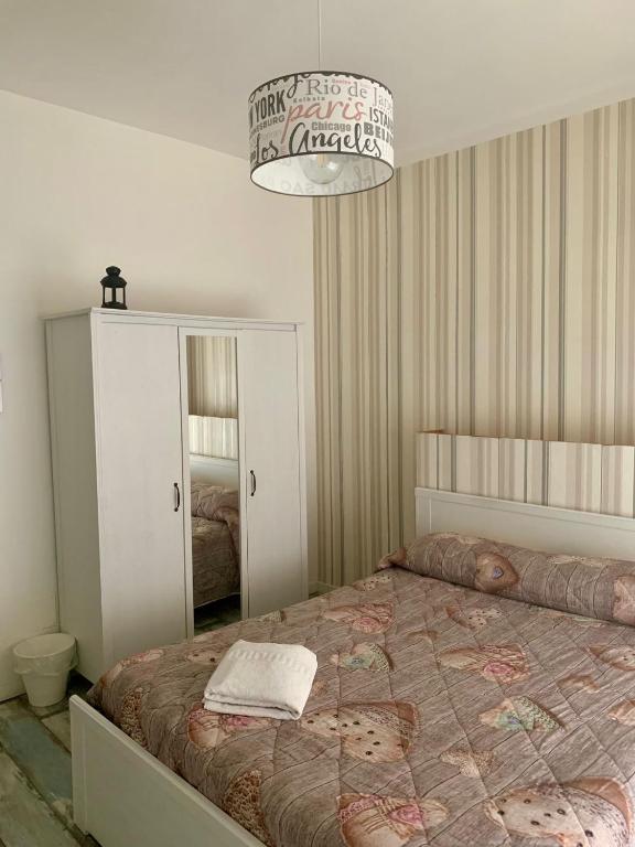 Posteľ alebo postele v izbe v ubytovaní B&B LE COCCINELLE