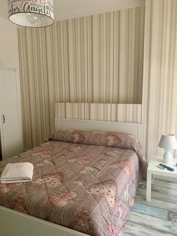 Posteľ alebo postele v izbe v ubytovaní B&B LE COCCINELLE