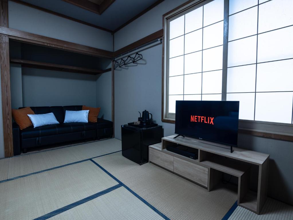 TV a/nebo společenská místnost v ubytování Welcome Nozawa