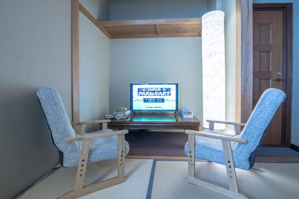 TV a/nebo společenská místnost v ubytování Welcome Nozawa