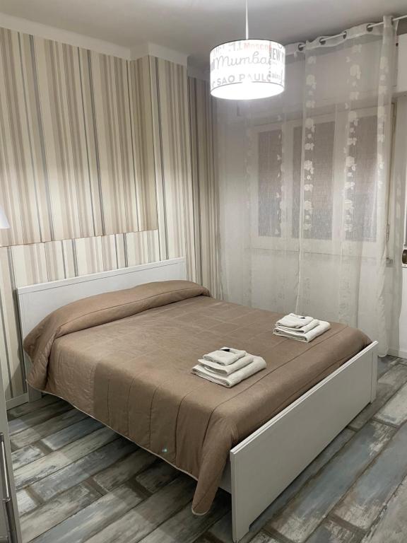 A bed or beds in a room at B&B LE COCCINELLE