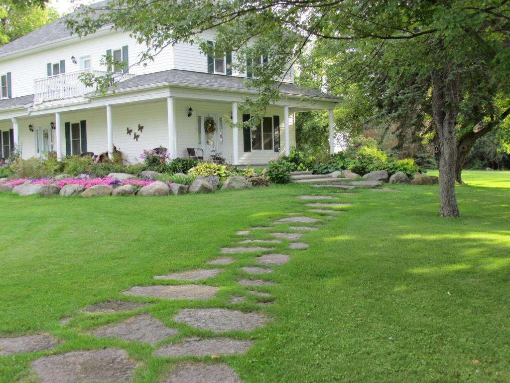 a house with a stone path in the yard at Terrace Green B&B in Winchester