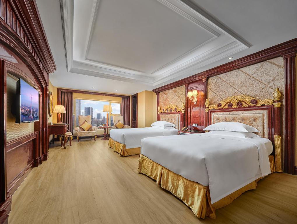 Postel nebo postele na pokoji v ubytování Yueda Financial City International Hotel