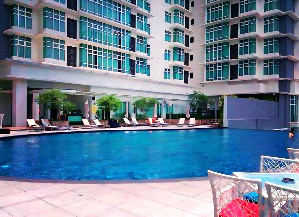 a large swimming pool in front of a building at KL Sentral Dua Sentral Cozy Homestay Apartments by Hollywood Homes #FreeCarPark in Kuala Lumpur