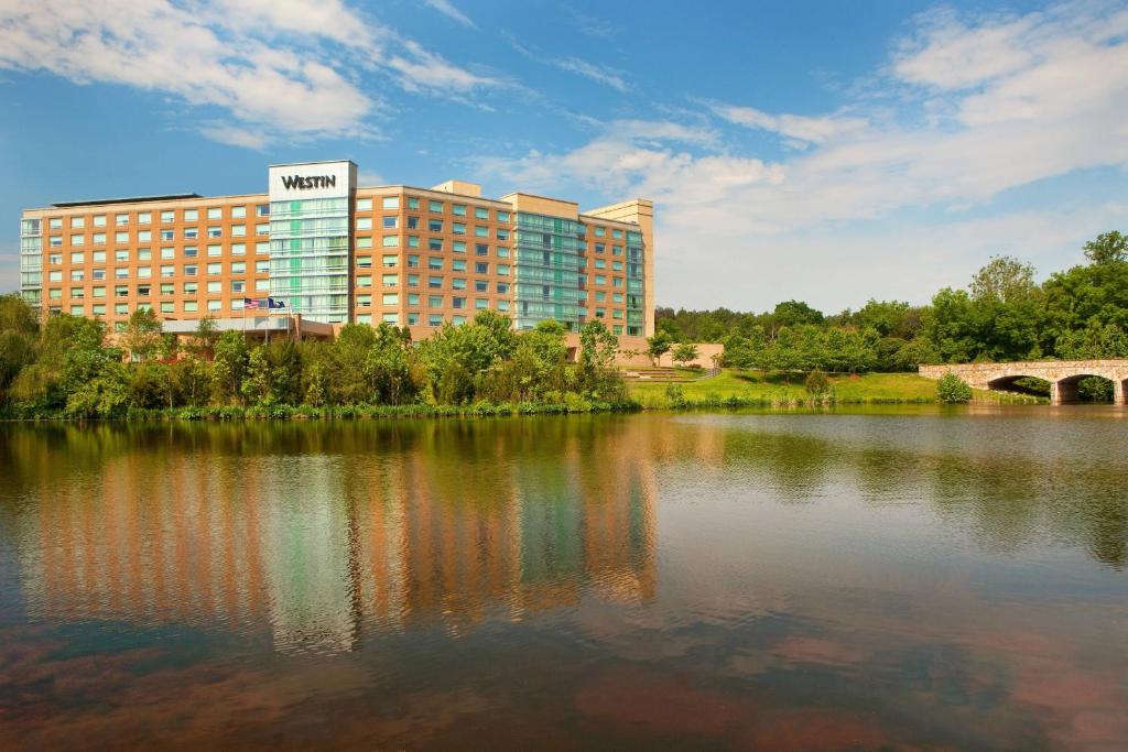 a view of a hotel with a large lake at The Westin Washington Dulles Airport in Herndon