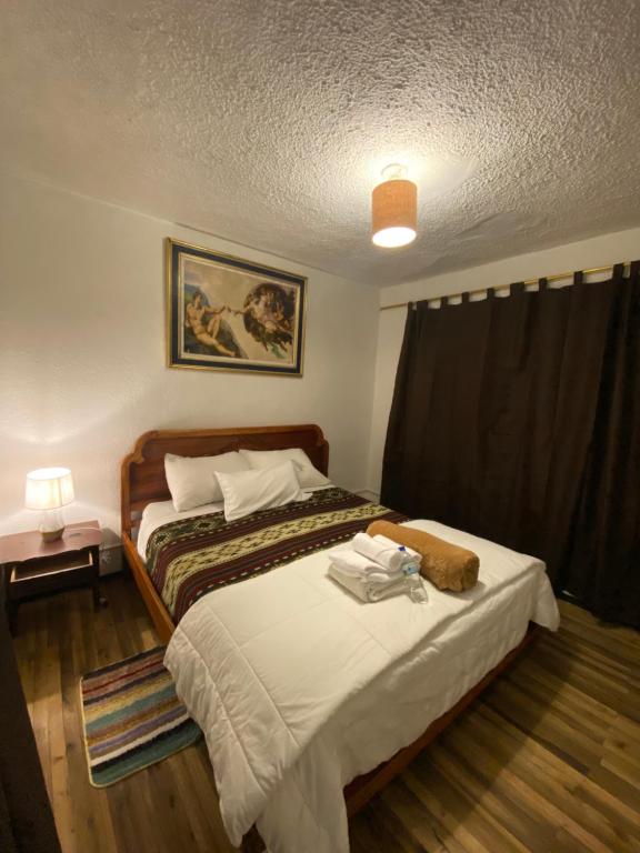 a bedroom with a bed in a room at El Monasterio in Quito
