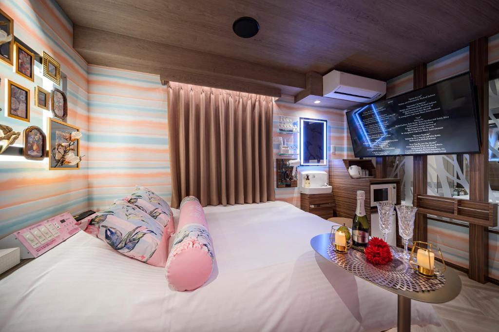 Postel nebo postele na pokoji v ubytování Hotel CARA 大人専用Adult only hotel
