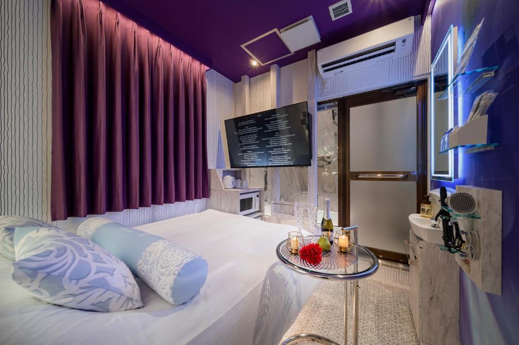 Postel nebo postele na pokoji v ubytování Hotel CARA 大人専用Adult only hotel