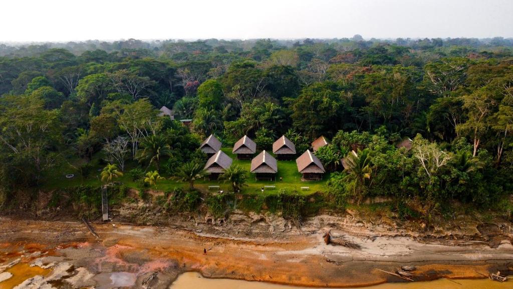 an aerial view of a resort on a tropical island at Tambopata Haven lodge in Puerto Maldonado
