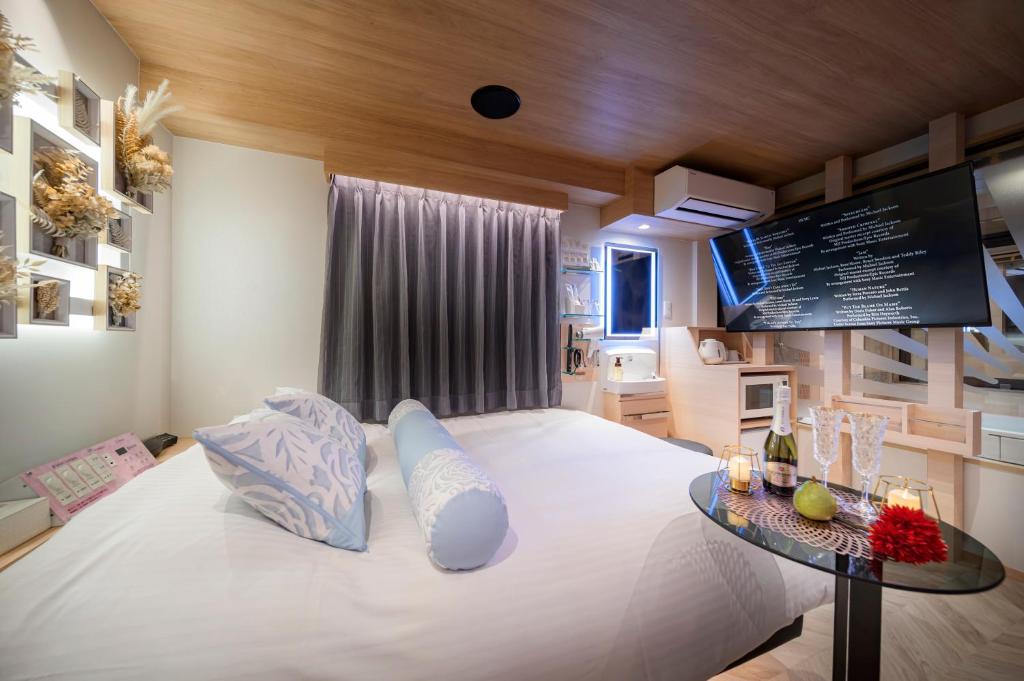Postel nebo postele na pokoji v ubytování Hotel CARA 大人専用Adult only hotel