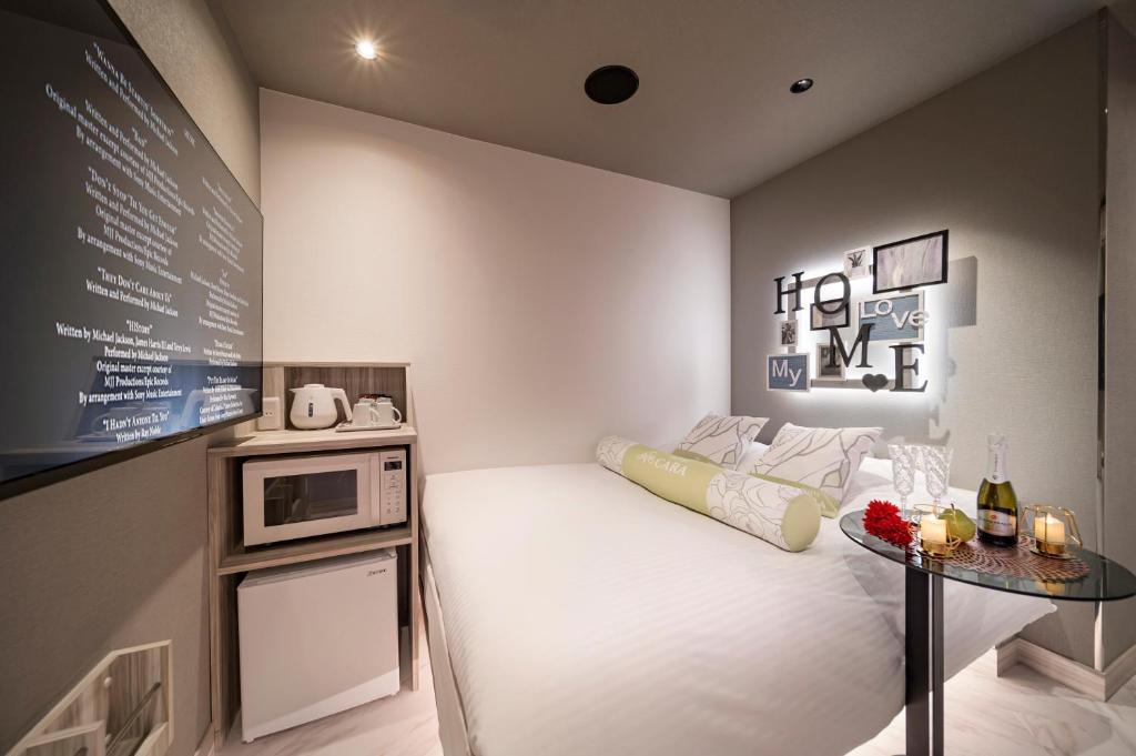 Postel nebo postele na pokoji v ubytování Hotel CARA 大人専用Adult only hotel