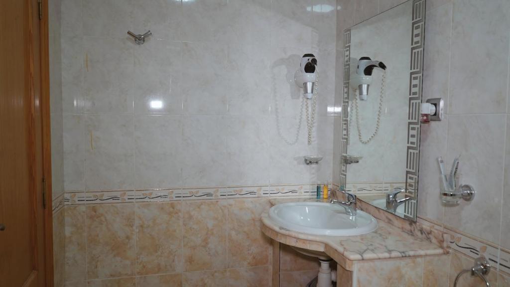 Koupelna v ubytování Hôtel Prestige
