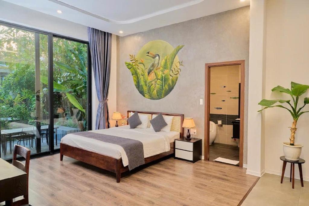 Postel nebo postele na pokoji v ubytování Charm Champion Villa Hoian