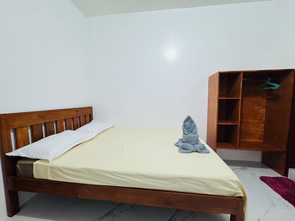 Postel nebo postele na pokoji v ubytování Baron Tourist Inn