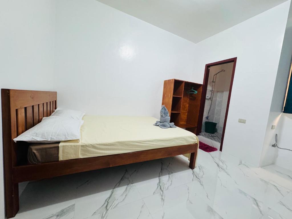 Postel nebo postele na pokoji v ubytování Baron Tourist Inn
