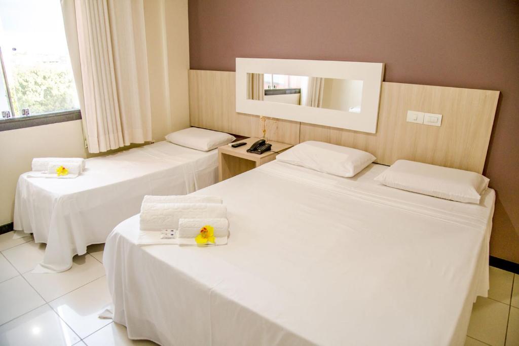 Postel nebo postele na pokoji v ubytování Eunapolis Plaza Hotel
