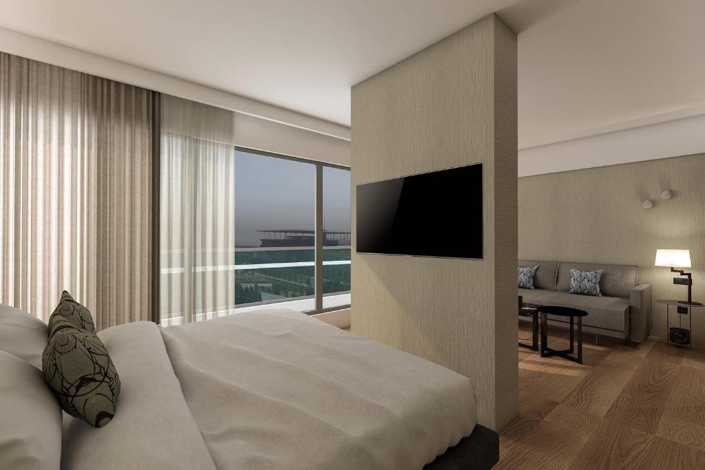 Postel nebo postele na pokoji v ubytování Athens Marriott Hotel