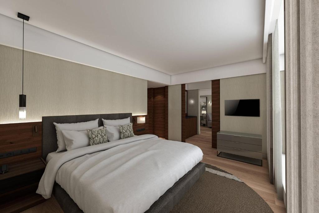 Postel nebo postele na pokoji v ubytování Athens Marriott Hotel