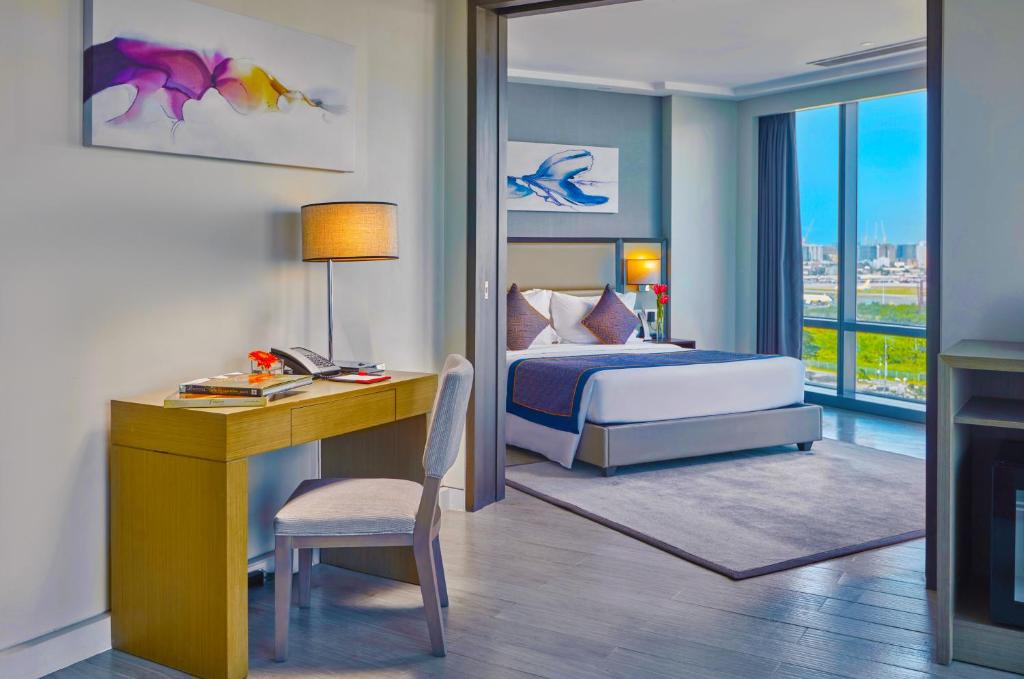 Postel nebo postele na pokoji v ubytování Savoy Hotel Manila near NAIA Terminal 3 MNL