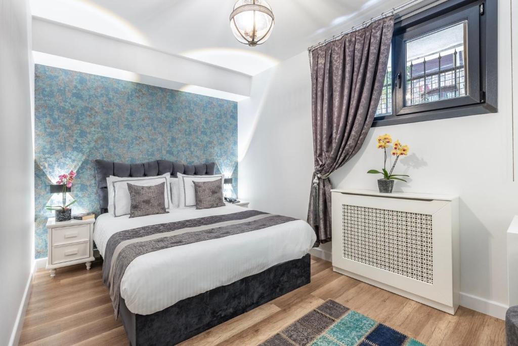 Postel nebo postele na pokoji v ubytování Hillora Hotel Buyukada