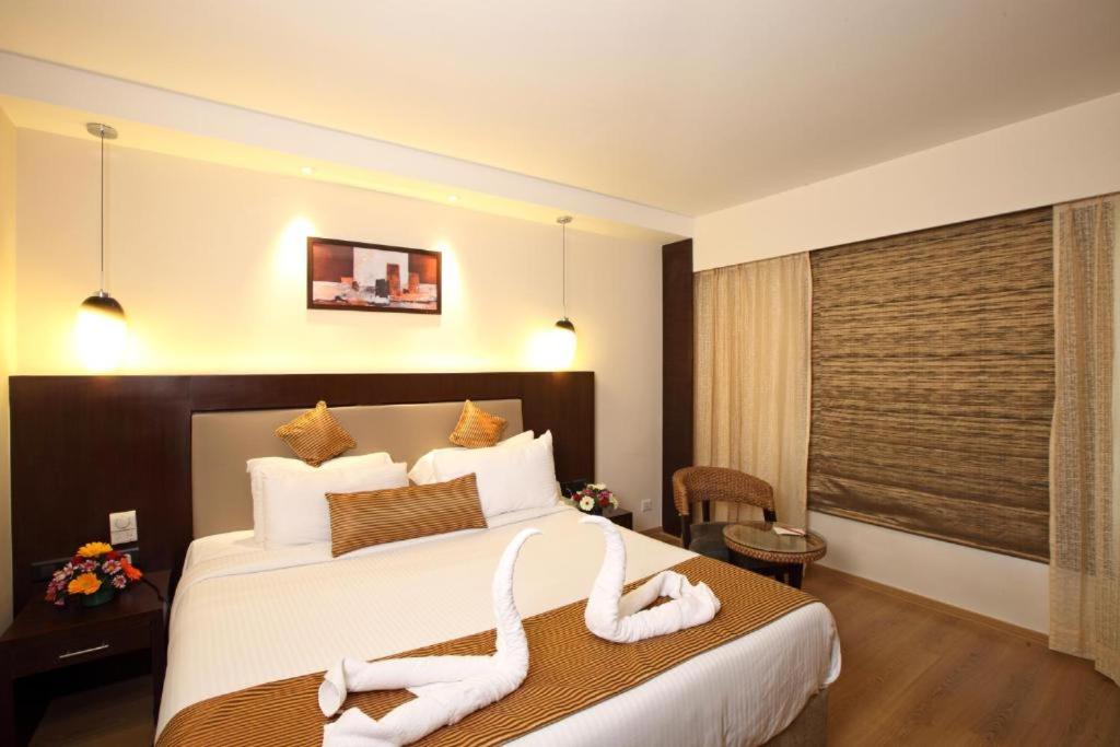 Postel nebo postele na pokoji v ubytování Hotel Vijaydeep Place Near Delhi Airport